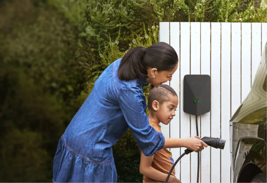 Evnex E2 smart EV charger installed in a residential garage — 7.4 kW single-phase charger with solar surplus integration and OCPP compatibility